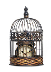 Vintage alarm clock in a cage - Concept of catch the time