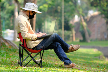 man sitting on a bench in the park