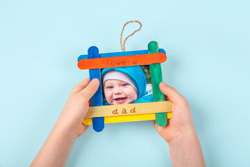 DIY and kid's creativity. Step by step instruction: how to make photo frame of ice cream sticks....