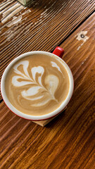 cup of coffee on wooden table