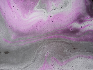 Colorful magenta bath foam with bubbles on the ground. Effect of space and galaxy. Beauty and luxury backdrop. Abstract art. Beautiful pink soap background with waves and foam. Washing suds texture