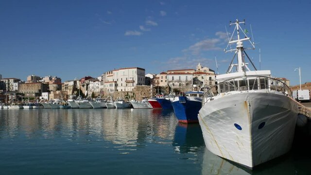 Termoli - Molise - Fishing boats at rest on a splendid sunny day, in the background the ancient village