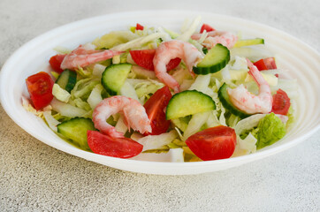 fresh summer salad of peking cabbage, cherry tomato, cucumber and shrimps
