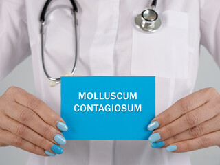 Healthcare concept meaning MOLLUSCUM CONTAGIOSUM with sign on the sheet.