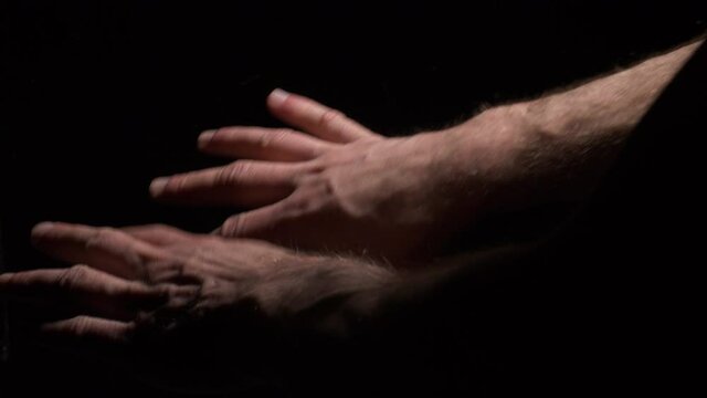 Conceptual shot of hands breaking loose from chains