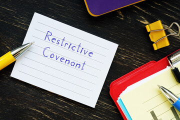  Financial concept about Restrictive Covenant with inscription on the sheet.