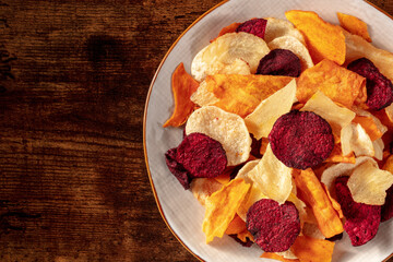 Healthy vegetable chips, close-up with a place for text