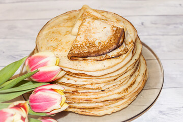 Appetite, delicious pancakes on a plate close-up.