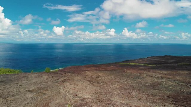  aerial shot by drone of lava flow in the blue ocean, cloud. Reunion island, idian ocean. 