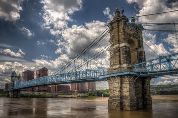 Fototapeta na wymiar John A. Roebling Suspension Bridge with clouds at Cincinnati, Ohio.