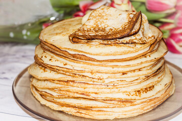Appetite, delicious pancakes on a plate close-up.
