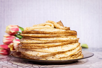 Appetite, delicious pancakes on a plate close-up.
