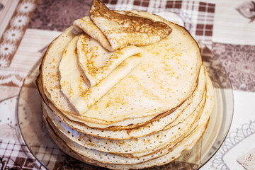 Appetite, delicious pancakes on a plate close-up.