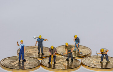 six miners standing and working on bitcoin crypto currency