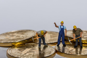 three miner working on gold shining bitcoins with gray