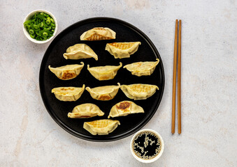 Japanese pan-fried dumplings, Gyoza, are popular weeknight meal as well as a great appetizer for dinner party.