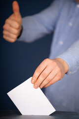 Voter Putting Ballot Into Voting box.