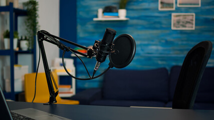 Station for recording and speaking during podcast in night in empty livin room studio. Influencer...