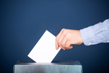 Voter Putting Ballot Into Voting box.