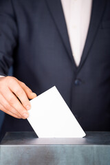 Voter Putting Ballot Into Voting box.