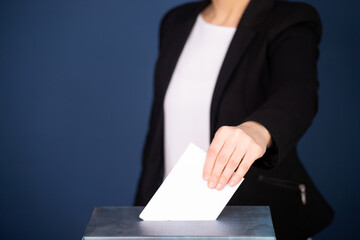 Voter Putting Ballot Into Voting box.