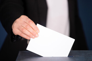 Voter Putting Ballot Into Voting box.