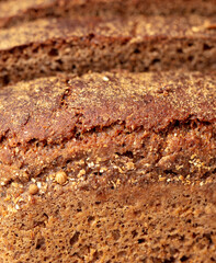 Black rye bread as background.
