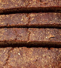 Black rye bread as background.
