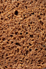 Black rye bread as background.