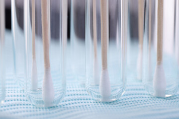 In test tube there are medical sticks for taking biological materia