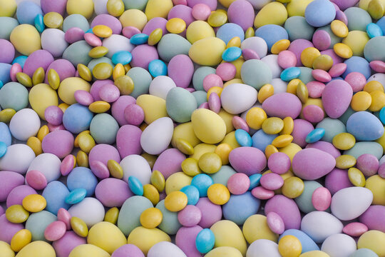 Lots of pastel colored Easter eggs chocolate, mini and small size, Spring image