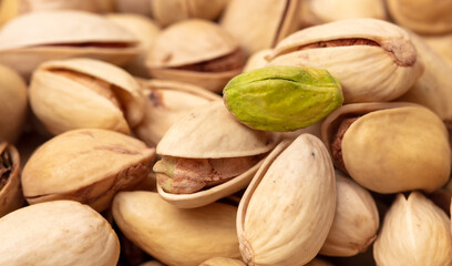 Close-up of fresh pistachio nuts as background.