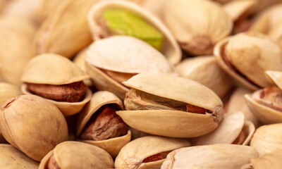 Close-up of fresh pistachio nuts as background.