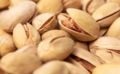 Obraz premium Close-up of fresh pistachio nuts as background.