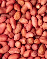 Close up of peanut nuts as background. Macro