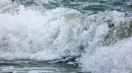 Wave in the sea with splashing water.