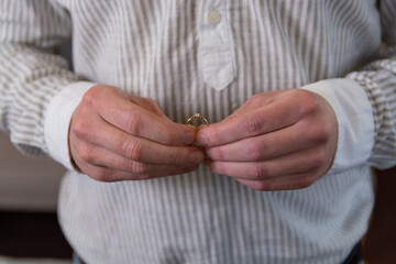 Romantic declaration of love. Wedding ring in the hands of a man.