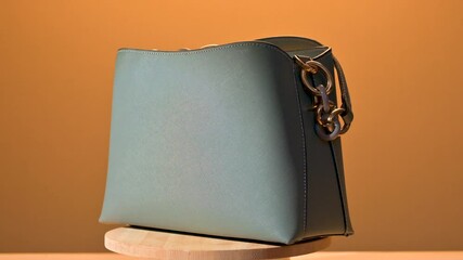 fashion women bag. Beautiful elegance and luxury fashion women bag. Women's leather grey handbag on yellow wooden table