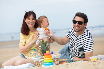 happy young family have fun on beach