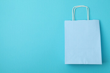 Blank paper bags on mint background, space for text