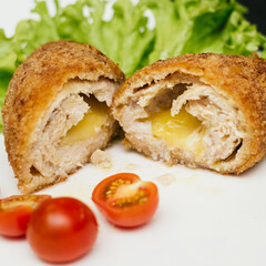 Kiev cutlet in the cut, and tomatoes