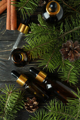 Aromatherapy concept with pine oil on wooden table