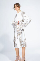 Young white woman isolated on light grey