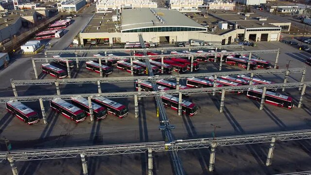 TTC public transit buses at large operations, maintenance and storage facility; aerial