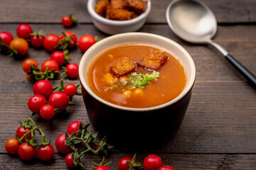 Homemade tomato soup with tomatoes, herbs and spices