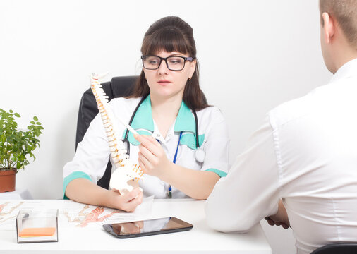 The Doctor Explains To The Patient On The Layout Of The Spine How The Modern Surgery On The Wound Will Be Performed Laser Puncture For Protrusion And Herniated Discs