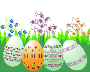 Four Easter eggs against the background of spring flowers and grass