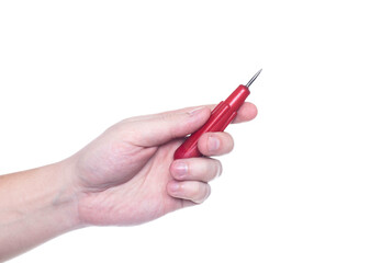 Man holds an awl in his hand on a white background, isolate. Close-up, production