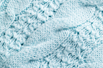 Knitted warm blue sweater, close-up. Background