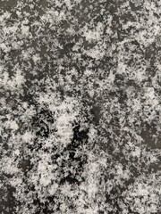 fluffy snowflakes on a dark surface. winter background